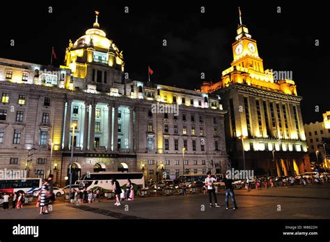 Night View Of Illuminated Colonial Buildings Along The Bund In Puxi