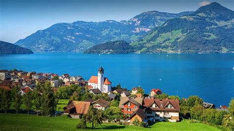Traditional Village Beckenried On Lake Lucerne In Swiss Alps