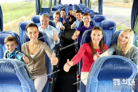 Group Of Happy Passengers Travelling By Bus Stock Photo Picture And