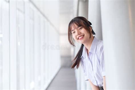 Beautiful High School Asian Student Girl In The School Uniform Stands