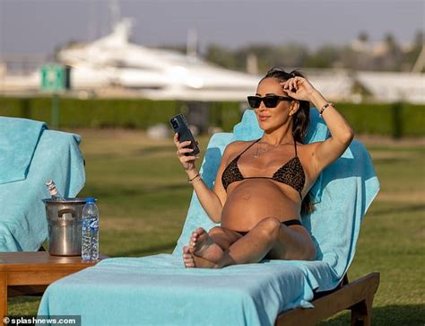 Pregnant Lauryn Goodman Displays Her Baby Bump In A Black Bikini As She