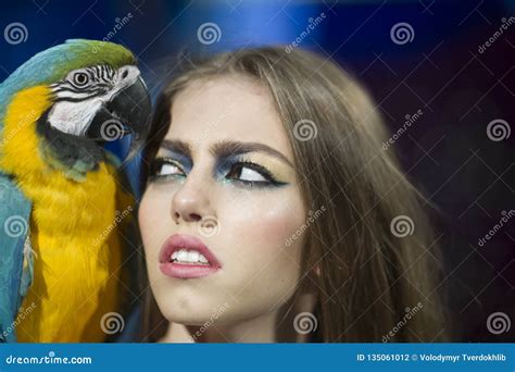 Sensual Woman Look At Parrot Woman With Blue And Yellow Macaw Girl