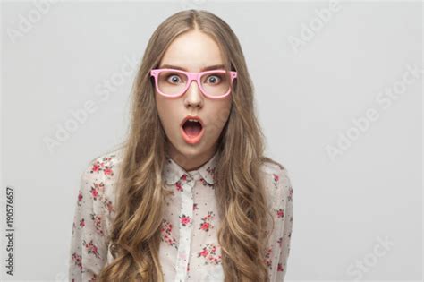 Portrait Young Blonde Girl Looking At Camera With Surprised Face And