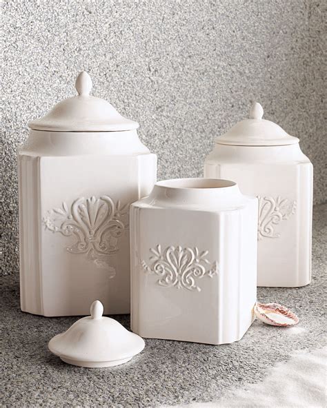 Three White Ceramic Canisters
