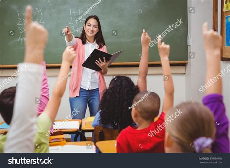 Stock Photo Teacher Asking Her Students A Question At The Elementary