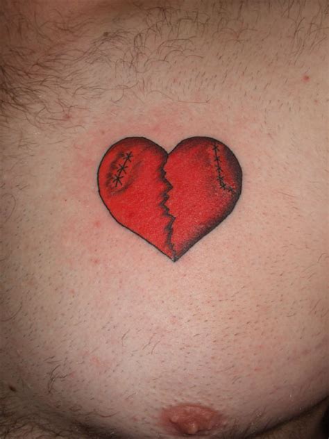 Red Broken Heart Tattoo On Chest | Tattoo Designs, Tattoo Pictures