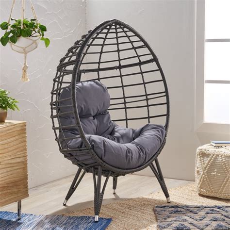 This club chair brings ultimate comfort to your patio or backyard space with its swivel function. Noble House Angelise Wicker Teardrop Chair with Cushion ...