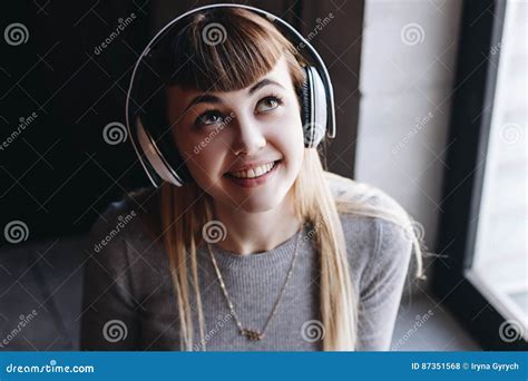 Beautiful Young Woman In Headphones Listening To Music Smiling Stock