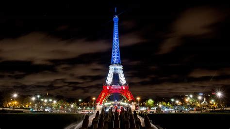 Eiffel Tower France French Flag The Eiffel Tower Is Illuminated With