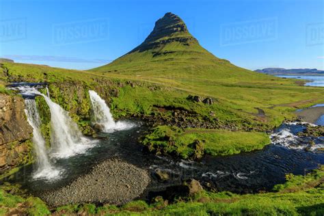 Kirkjufellsfoss Waterfall And Kirkjufell Mountain In Grundarfjordur