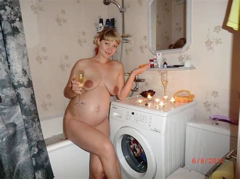 odd place to have a candle lit dinner but hey naked pregnant woman