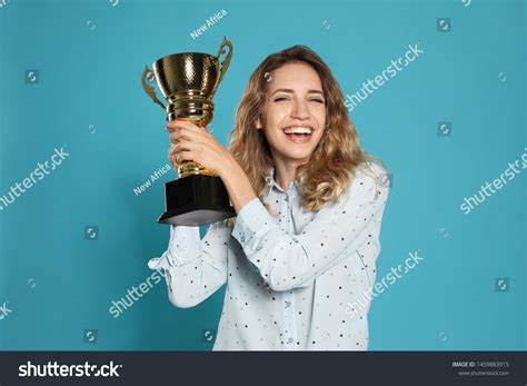 Woman Holding Trophy Over 6201 Royalty Free Licensable Stock Photos