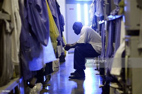 An Inmate At The Mule Creek State Prison Sits On His Bunk Bed In A
