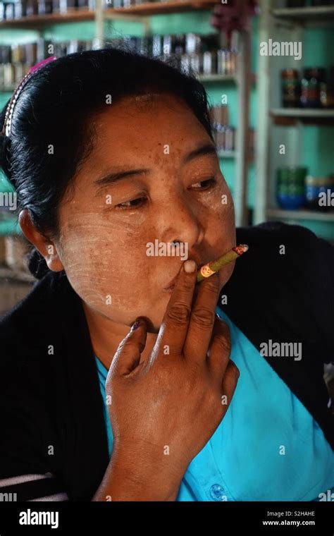 Mid Aged Burmese Woman Smoking A Cigarette Stock Photo Alamy