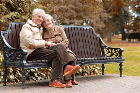 Elderly Couple On Bench