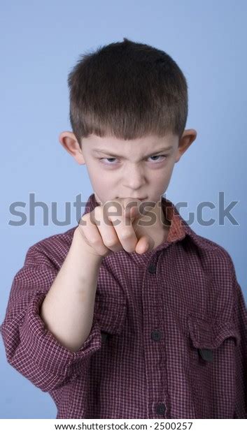 Young Boy Mean Expression Pointing His Stock Photo 2500257 Shutterstock