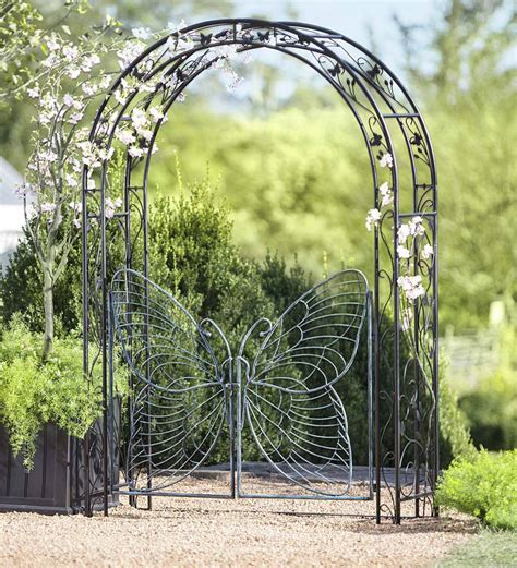 Panacea arbour features an arched top and charming hinged garden gates to create a striking entrance to your garden or walkway curved hinged gates with latch fo. Metal Garden Arbor with Butterfly Gate | PlowHearth