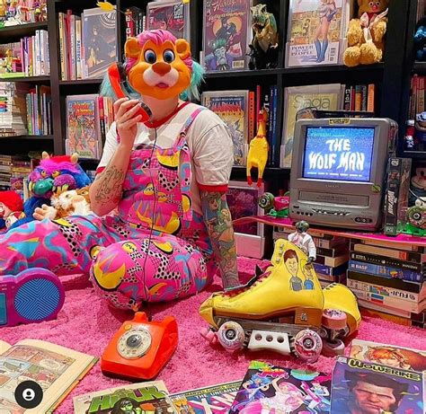 A Person Sitting On The Ground Surrounded By Toys