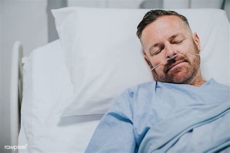 Download Premium Image Of Sick Man In A Hospital Bed By Chanikarn