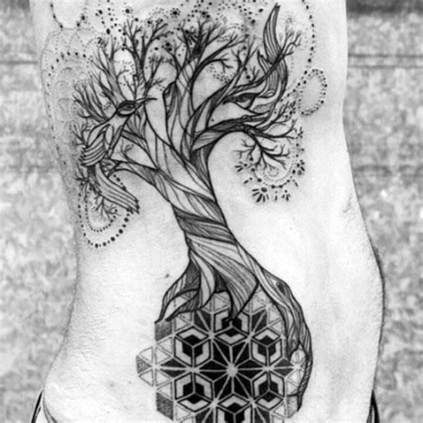 A Person With A Tree Tattoo On Their Stomach And The Bottom Part Of His