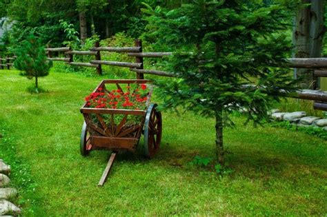 Don't cut notches in the posts to. 27 Wheelbarrow Planter Ideas | Garden Outline