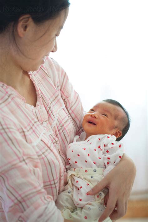 Mother mother consists of ryan guldemond on guitar and vocals. young asian mother holding her newborn baby smile by Bo Bo ...