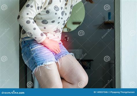 hands woman holding her crotch female need to pee urinary incontinence royalty free stock image