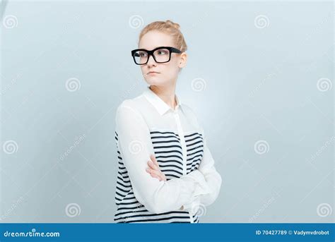 beautiful woman with arms folded looking away stock image image of pretty blond 70427789