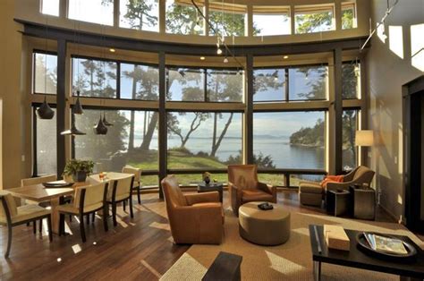 Beautiful Lakefront House With Large Windows Surrounded By Gorgeous Trees