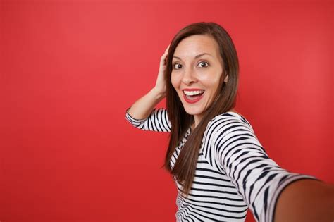 Free Photo Close Up Selfie Shot Of Excited Young Woman In Striped Clothes Keeping Mouth Wide
