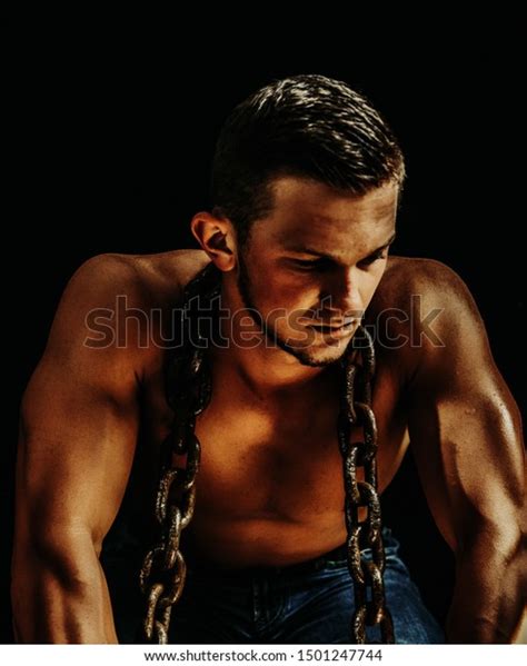 Determined Muscular Man Holding Chains Against Stock Photo 1501247744