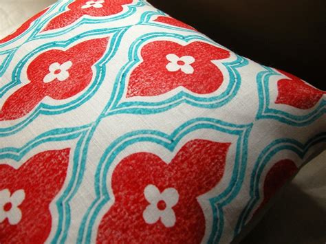 Still on the fence about this fun color combo? Red + turquoise throw pillows! Love!! For the fire pit ...