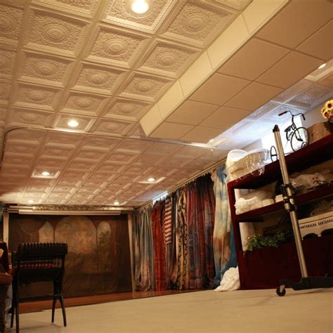 It can be glued over most stable ceiling surfaces including popcorn ceilings and painted to your likeness. Tin Ceiling Tiles Basement | Faux tin ceiling tiles, Easy ...