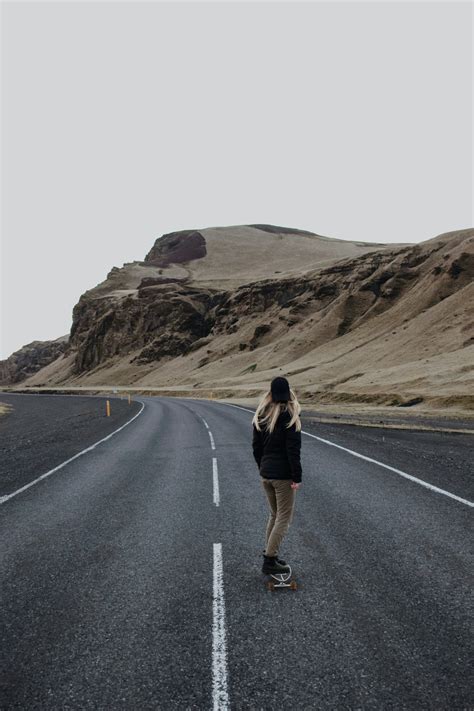 Woman Standing On Road During Daytime Photo Free Road Image On Unsplash