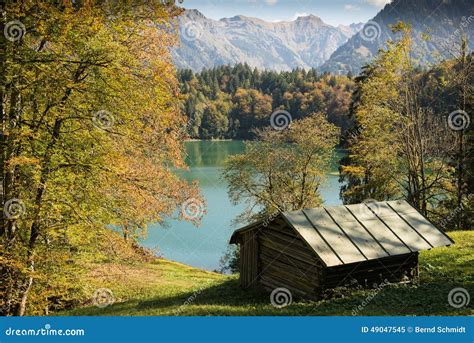 Idyllic Cabin In Fall At A Turquoise Lake Stock Image Image Of