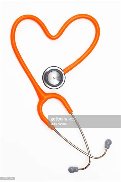 Red Stethoscope Creating A Shape Of A Heart High Res Stock Photo