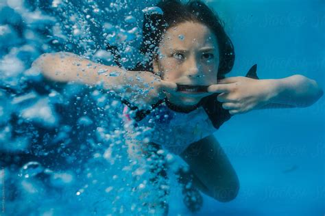 Young Preteen Girl Having Fun Swimming In A Pool Underwater By Robert Lang