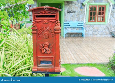 Red Old Fashioned Mailbox Or Vintage Post Box In Front Of House Stock