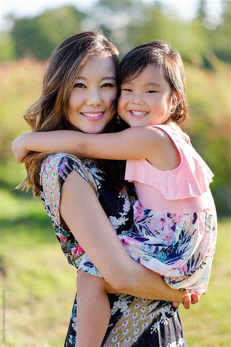 Asian Mother And Daughter Having Fun Outdoor Happy