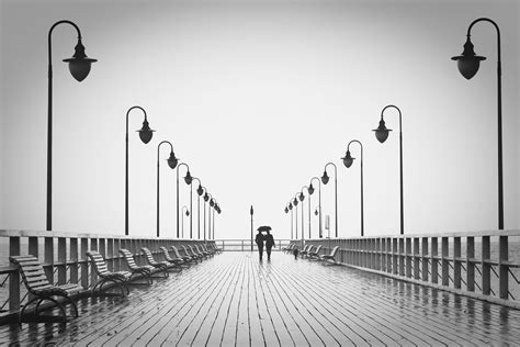 Two People Walking On Pier · Free Stock Photo