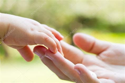 Caring Mother And Babys Hands — Stock Photo © Michaeljung
