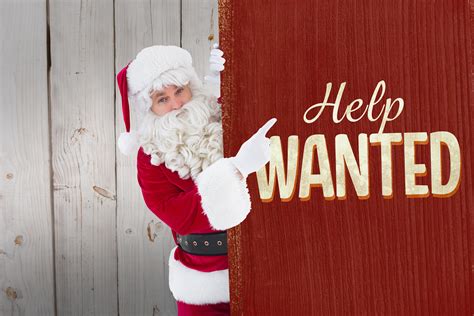 Smiling Santa Claus Pointing Poster Against Vintage Help Wanted Recruiteze