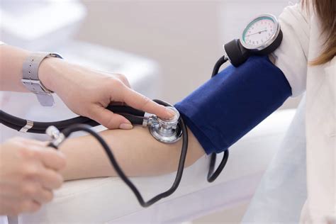 Doctor Measuring Blood Pressure From Her Patient Close Up First Aid