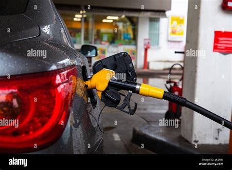 Pumping Gasoline Fuel In Car At Gas Station Refueling Automobile With