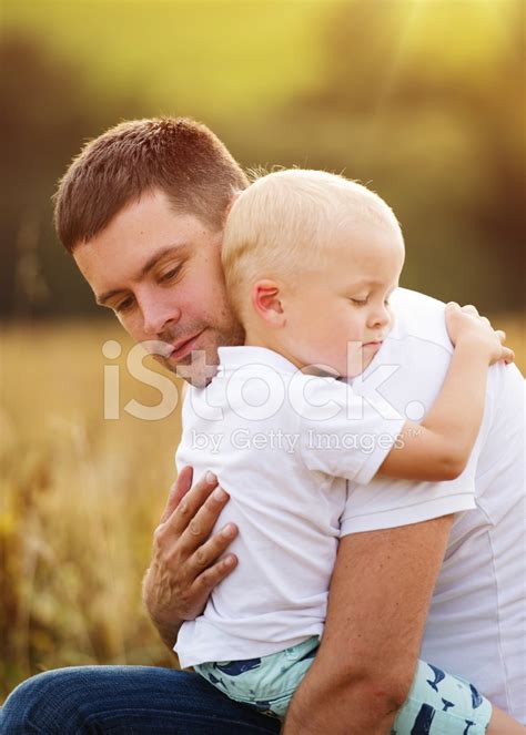 Father And Son Hugging Stock Photos