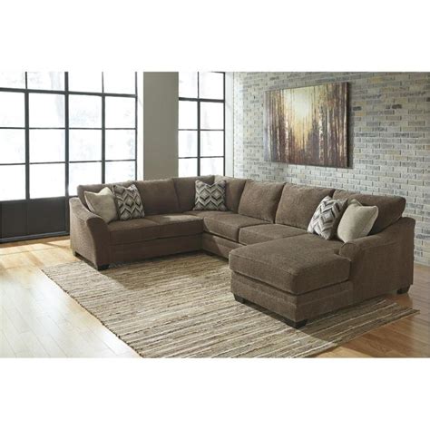 The entire printed ad, online price or digital version of the ad must be presented. 8910234 Ashley Furniture Justyna - Teak Armless Loveseat