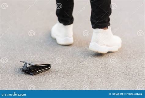 Man Accidently Dropped His Leather Wallet With Money Stock Photo