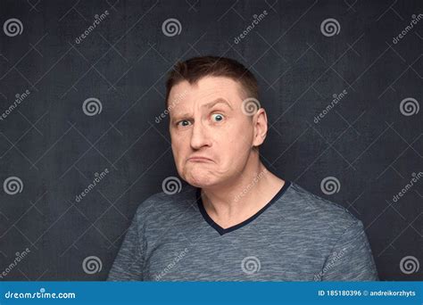 Portrait Of Angry And Dissatisfied Man Frowning Face Stock Photo