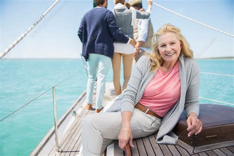 older woman sitting on boat stock image f014 8386 science photo library