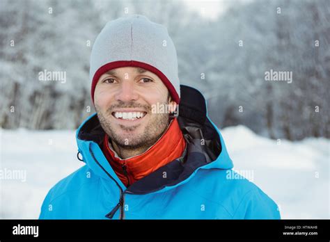 Portrait Of Man Standing On Snowy Landscape Stock Photo Alamy